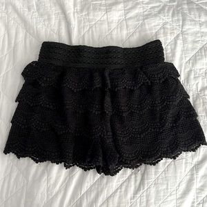 Black mid-rise lace shorts